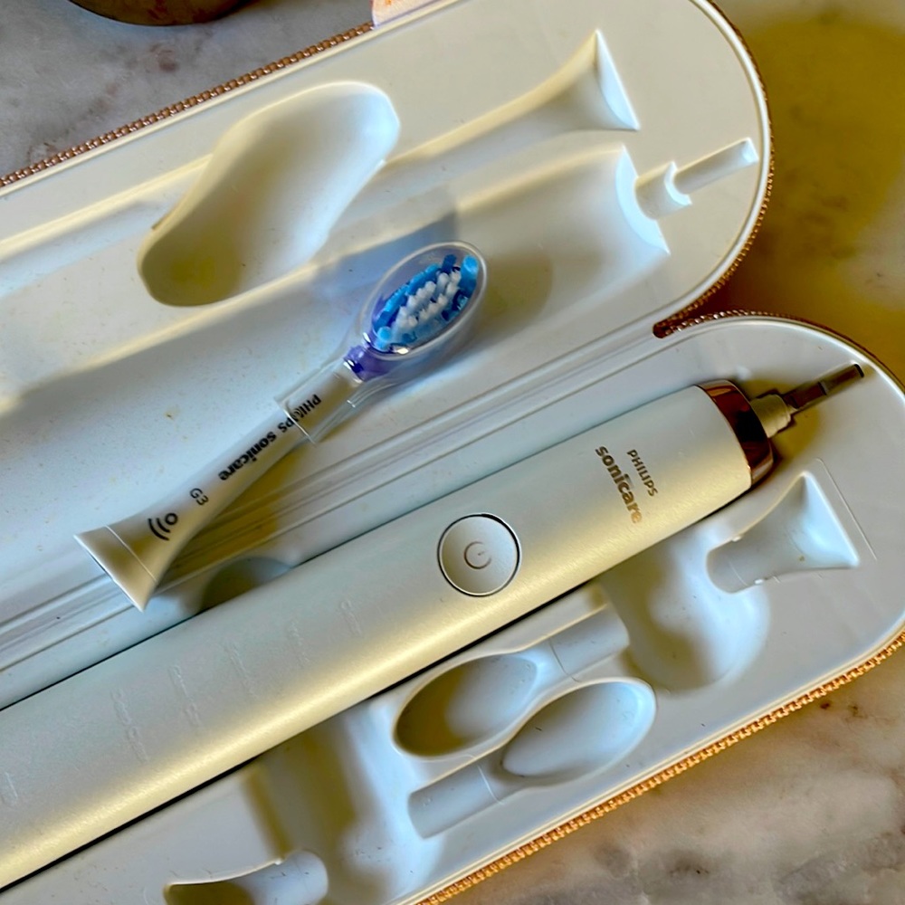 Rose gold sonicare toothbrush + new sonicare head.
